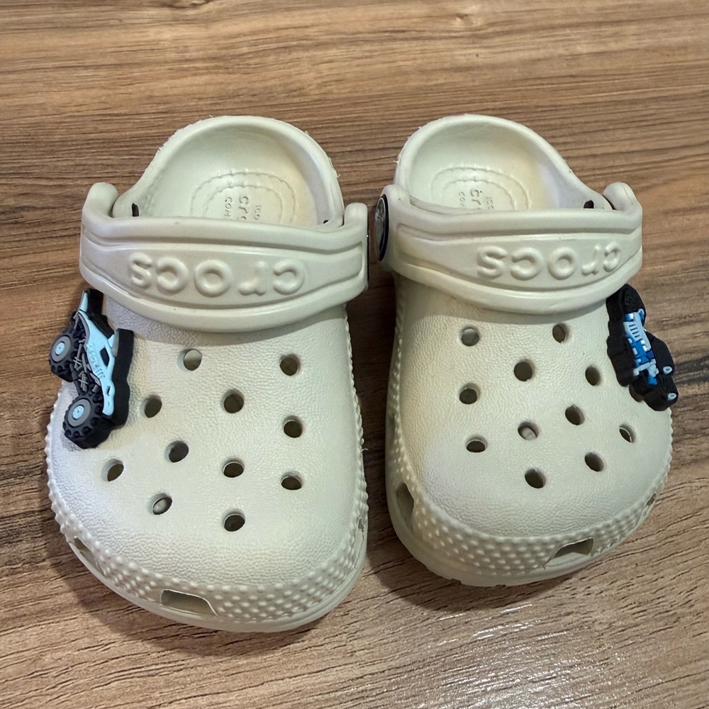 Boy or Girl Baby Crocs Size 4C. Trucks can be removed if desired. Cream color.
